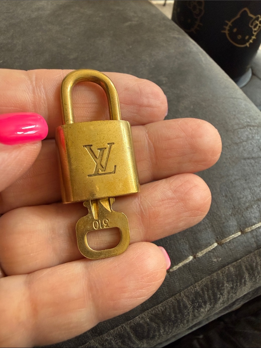 Louis Vuitton Gold Tone Padlock with Key. 310